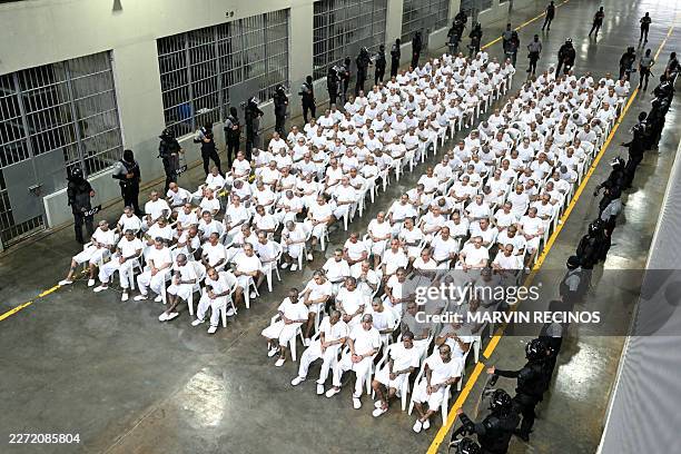 Alleged members of the Mara Salvatrucha gang attend a remote court hearing by videoconference at the Terrorism Confinement Center in Tecoluca, El...