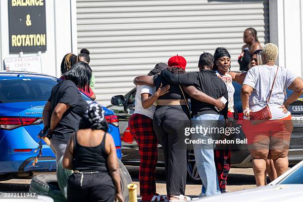 Community members gather to grieve the death of eight children and two women during a mass shooting on April 19, 2026 in Shreveport, Louisiana. Eight...