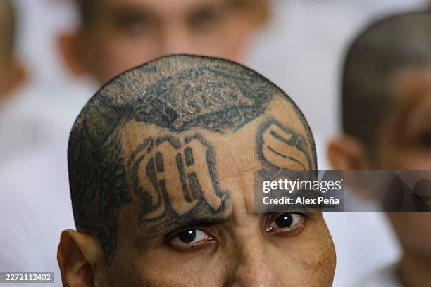 Prisoner looks on during a massive hearing against criminals and gang members at CECOT on April 23, 2026 in Tecoluca, El Salvador. In 2023, El...