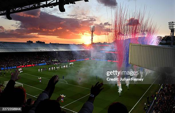 General view as fans show their support as pyrotechnics are let off as the teams make their way onto the pitch prior to the Premier League match...