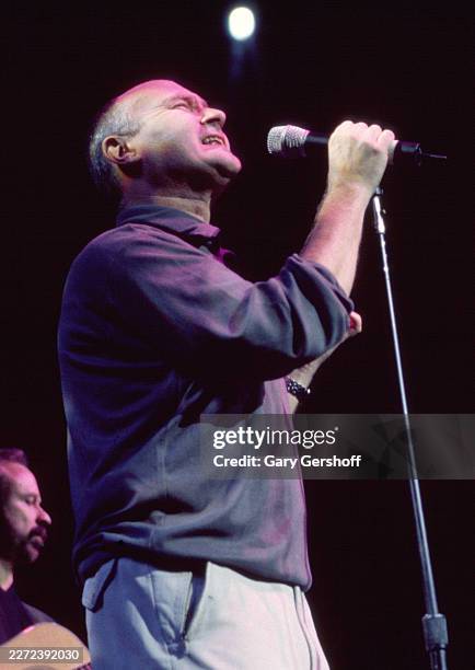 British Pop musician Phil Collins performs during a concert onstage at the Theater at Madison Square Garden , New York, New York, November 1, 1999.