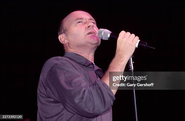 British Pop musician Phil Collins performs during a concert onstage at the Theater at Madison Square Garden , New York, New York, November 1, 1999.