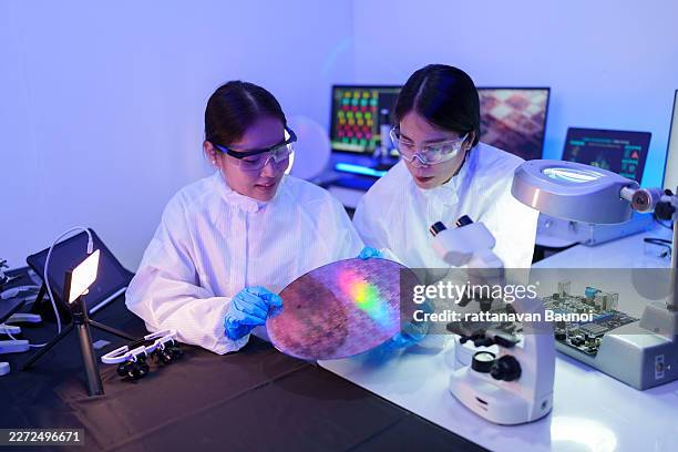 technician working on analyzing semiconductor or microchip boards, electronics industry, electronic engineer, computer technology, cpu maintenance, hardware, motherboard component upgrades. - quantum physics stock pictures, royalty-free photos & images