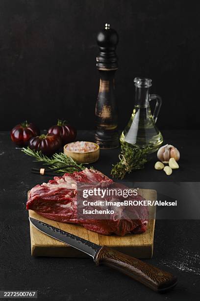 raw beef top round roast with spices on dark background - round roast beef stock pictures, royalty-free photos & images