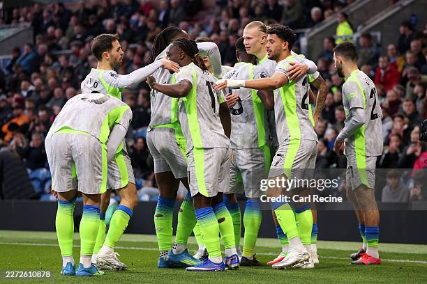 Erling Haaland of Manchester City celebrates scoring his team's first goal with teammates during the Premier League match between Burnley and...
