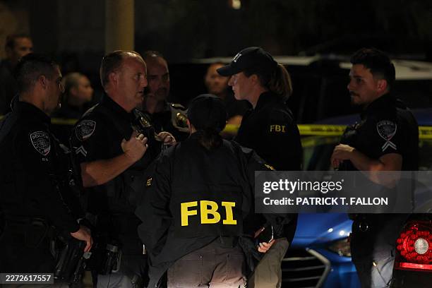 Agents are seen outside a residence associated with the alleged White House Correspondents' Dinner shooter in Torrance, California, on April 25,...