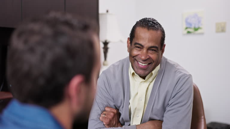 https://media.gettyimages.com/id/2272622582/video/young-man-in-counseling-session-with-a-mature-black-counselor.jpg?b=1&s=640x640&k=20&c=DbnZLoTDtKCGaIPq5futKfVDHbMCrKdYPX5ycs69YTQ=