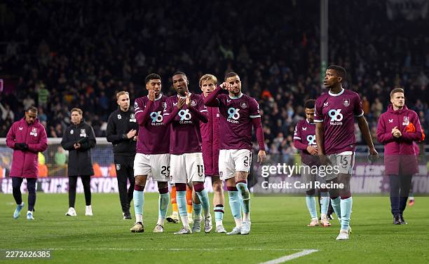 Jaidon Anthony and Kyle Walker of Burnley applaud the fans with teammates after the Premier League match between Burnley and Manchester City at Turf...