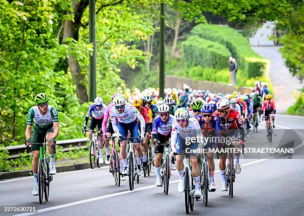 The pack of riders cycles during the men elite race of the Liege-Bastogne-Liege UCI World Tour one day cycling race 5km from Liege, over Bastogne to...