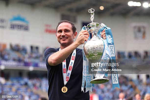 Coventry City Manager Frank Lampard celebrates with the Championship trophy after the Sky Bet Championship match between Coventry City and Wrexham...