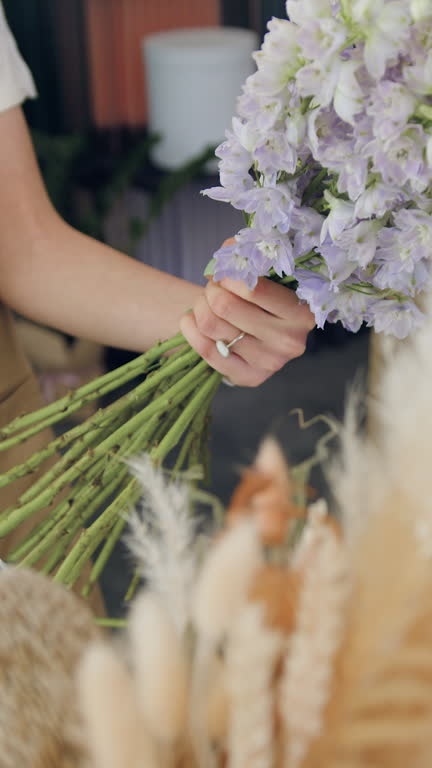 https://media.gettyimages.com/id/2272725908/video/close-up-of-woman-arranging-flowers-and-cutting-stems-with-pruning-scissor-young-lady-making.jpg?b=1&s=640x640&k=20&c=qbgWAiCxoD_n2mtNCdhP8Ge96vARYK7hadk1eM6ajnQ=