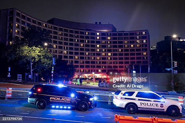 Secret Service vehicles parked outside of the Washington Hilton after the White House Correspondents Association Dinner was postponed April 25, 2026...