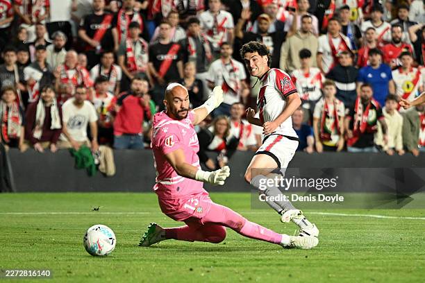 Sergio Camello of Rayo Vallecano scores his team's first goal past Marko Dmitrovic of RCD Espanyol during the LaLiga EA Sports match between Rayo...