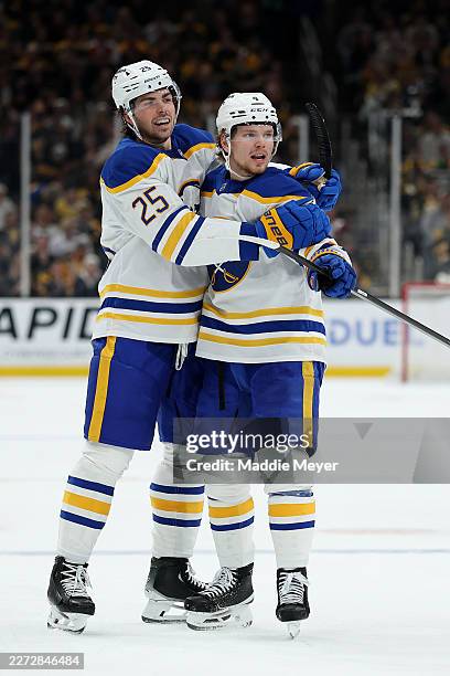 Bowen Byram of the Buffalo Sabres celebrates with Owen Power after scoring against the Boston Bruins during the second period Game Three of the First...