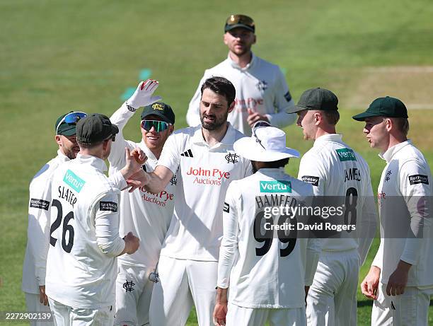 Brett Hutton of Nottinghamshire celebrates with team mates after taking the wicket of Alex Davies during the Rothesay County Championship Division 1...