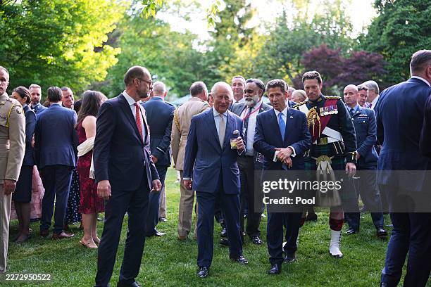 Britain's King Charles III and British Ambassador to the U.S. Christian Turner attend a garden party at the British Embassy on day one of King...
