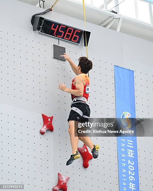 Zhao Yicheng of China competes during the men's individual qualification of sport climbing speed at the 6th Asian Beach Games in Sanya, south China's...