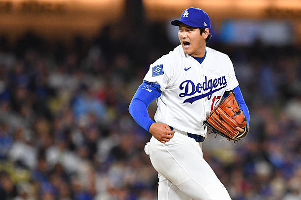 Los Angeles Dodgers pitcher Shohei Ohtani reacts after getting out of a jam during the MLB game between the Miami Marlins and the Los Angeles Dodgers...