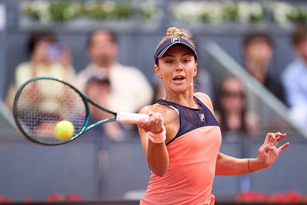 Jaqueline Cristian of Belgium returns the ball against Aryna Sabalenka during the Women's Singles Round of 32 match on day six of the Mutua Madrid...