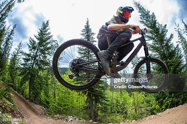 mountain bike jump - wide angle stock pictures, royalty-free photos & images