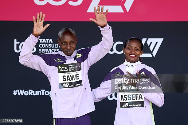 Men's winner Sabastian Sawe of Team Kenya and Women's winner Tigst Assefa of Team Ethiopia pose for a photo at the presentation ceremony after the...
