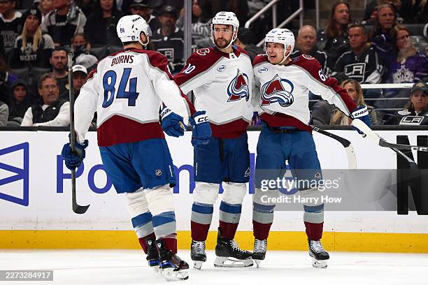 Nicolas Roy of the Colorado Avalanche is congratulated by Brent Burns and Artturi Lehkonen after scoring a goal against the Los Angeles Kings during...