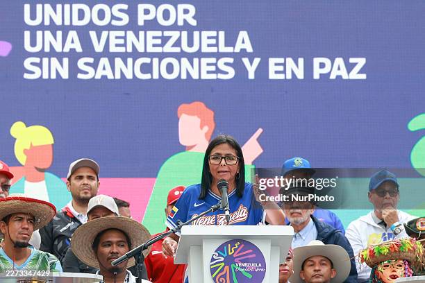Acting President Delcy Rodriguez delivers a speech to supporters of the ruling party during a march calling for an end to sanctions in Caracas,...
