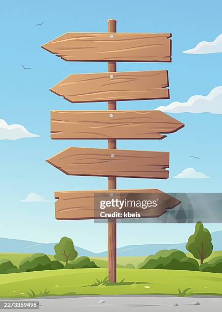 directional arrow signs at the roadside in cartoon style - directional sign stock illustrations