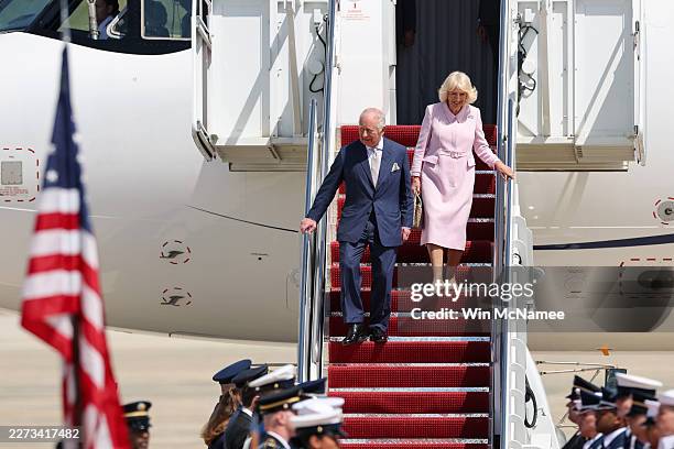 King Charles III and Queen Camilla disembark their plane as they arrive on day one of their State Visit to the United States, on April 27, 2026 at...
