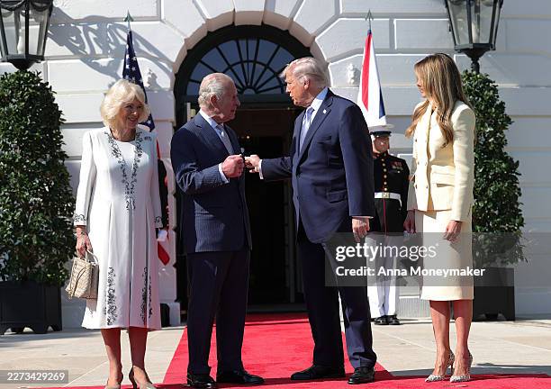 President Donald Trump and first lady Melania Trump greet Queen Camilla and King Charles III on the South Lawn of the White House as they arrive for...