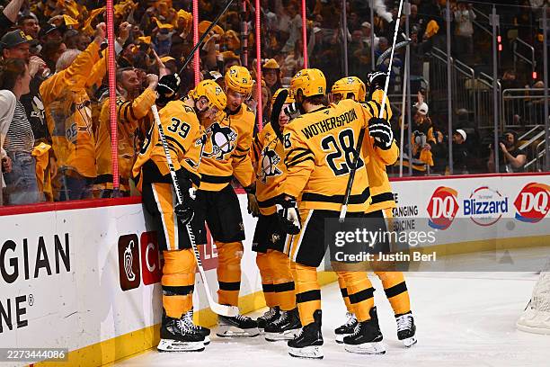 Elmer Soderblom of the Pittsburgh Penguins celebrates with teammates after scoring a goal against the Philadelphia Flyers during the first period in...