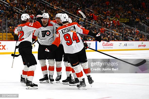 Travis Sanheim of the Philadelphia Flyers celebrates with teammates after scoring a goal against the Pittsburgh Penguins during the second period in...