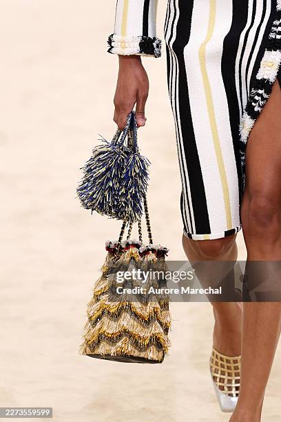 Model, bag detail, walks the runway during the Chanel Cruise 2026/27 on April 28, 2026 in Biarritz, France.