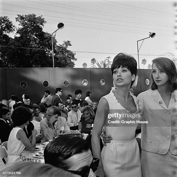 American actress Suzanne Pleshette, wearing a light-coloured sleeveless outfit with a ruffled neckline, attends a 'Young Citizens for Johnson'...
