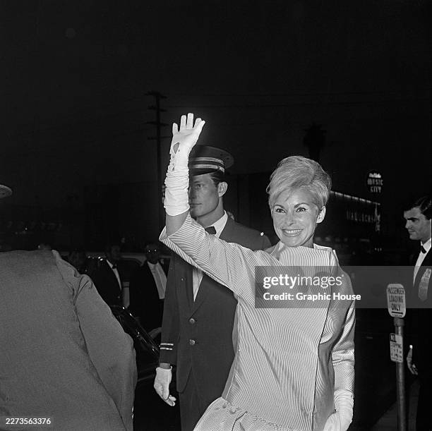 American actress Lydia Clarke and her husband, American actor Charlton Heston, attend the Hollywood premiere of 'Khartoum' at the Cinerama Dome in...