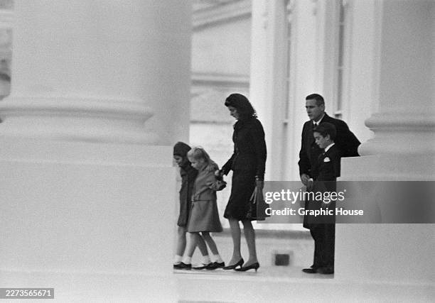 American former First Lady Jacqueline Kennedy and her children, John and Caroline, leaving the United States Capitol where her late husband, John F...