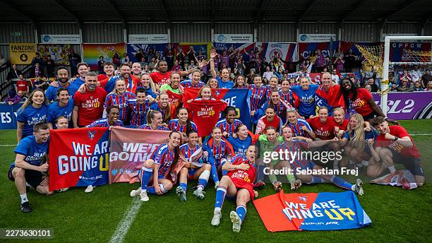 Crystal Palace players and staff celebrate promotion to the Barclays Women's Super League after the team's victory in the Barclays Women's Super...