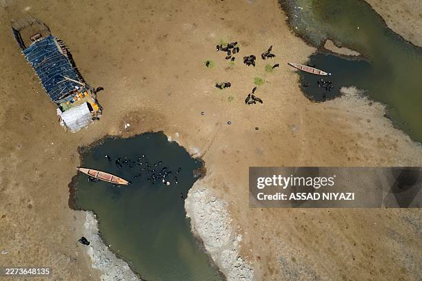An aerial photograph shows settlements along the edge of the al-Chibayish Marches following recent rains, near the town of Al-Chibayish close to the...