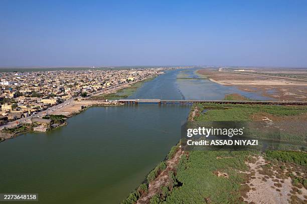 An aerial photograph shows the al-Chibayish Marches following recent rains, and the town of Al-Chibayish close to the Euphrates River in Dhi Qar...