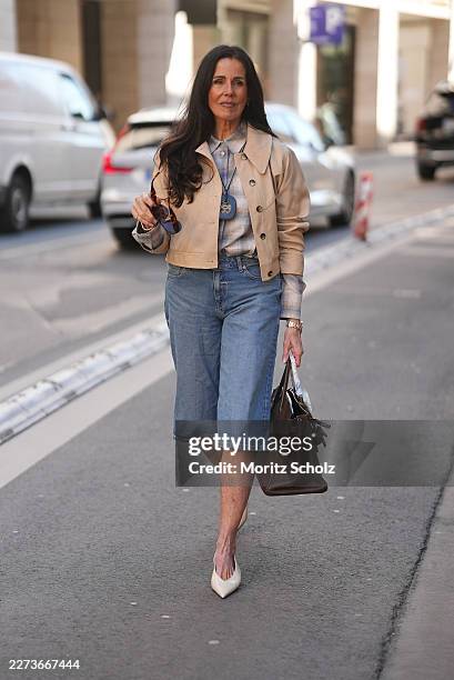 Angelika Hanel is seen wearing a beige cropped jacket in a coated leather-look finish with a small spread collar with logo stitching, single-breasted...