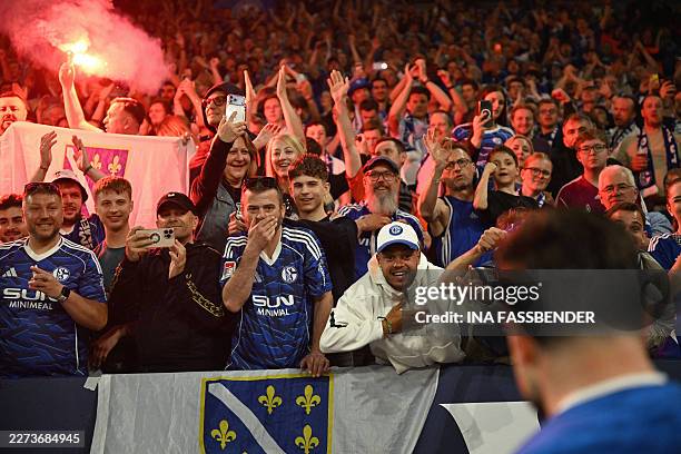 Schalke fans celebrate after the German second division Bundesliga football match between FC Schalke 04 and Fortuna Duesseldorf at the Veltins Arena...