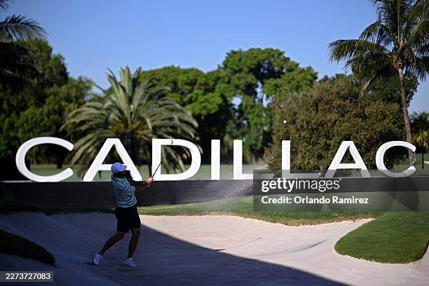 Scottie Scheffler of the United States plays a shot from a bunker on the 16th hole prior to the Cadillac Championship 2026 at Trump National Doral...