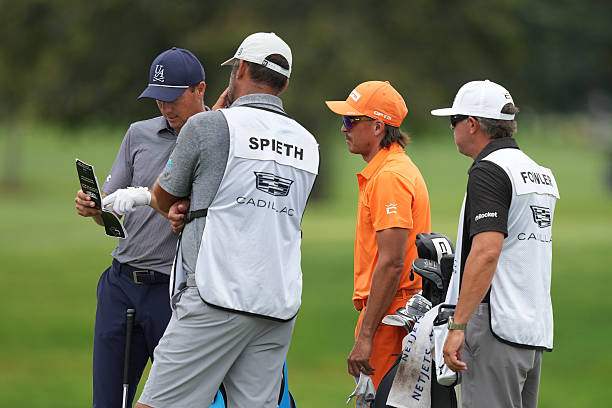 Jordan Spieth and Rickie Fowler stand together on the third green during the final round of Cadillac Championship at Trump National Doral - Blue...