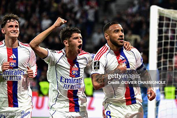 Lyon's French midfielder Corentin Tolisso celebrates scoring his team's second goal during the French L1 football match between Olympique Lyonnais...