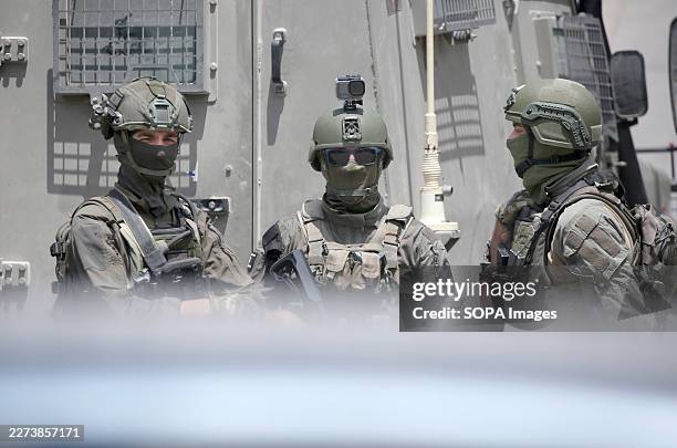 Israeli soldiers seen standing during a military operation. Israeli forces raided the market in the city center and opened fire on shoppers who were...