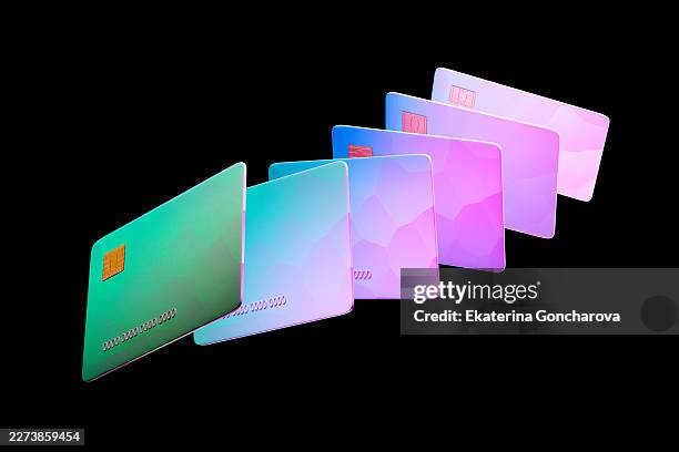 financial credit cards displaying colorful modern security chips - pago con tarjeta fotografías e imágenes de stock
