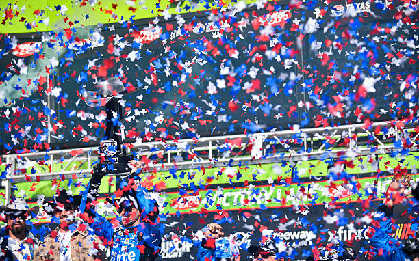 Chase Elliott lifts the trophy after winning NASCAR Cup Series Wurth 400 on May 3 at the Texas Motor Speedway in Fort Worth, TX.