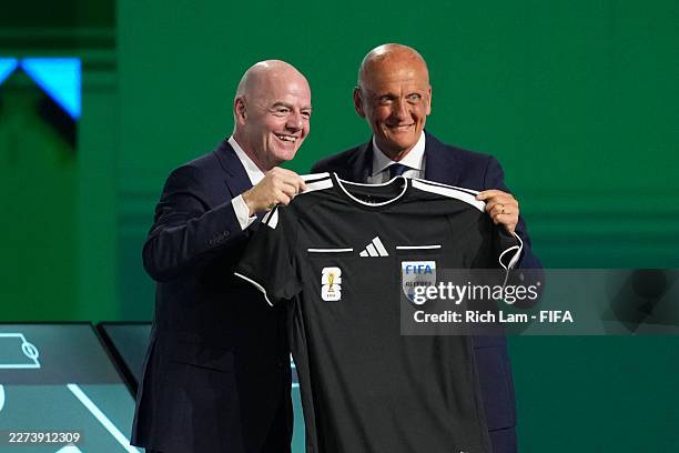 Gianni Infantino, President of FIFA, receives a referee jersey form Pierluigi Collina, Chairman of the FIFA Referees Committee, during the 76th FIFA...