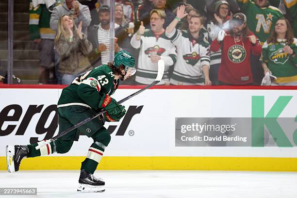 Quinn Hughes of the Minnesota Wild celebrates a goal after scoring a goal against the Dallas Stars during the first period in Game Six of the First...