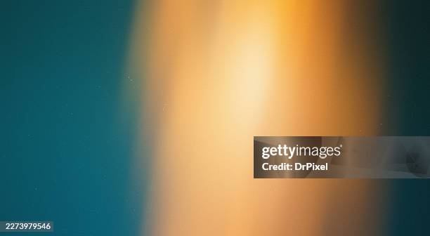 abstract teal orange light leak background - light effect stock pictures, royalty-free photos & images